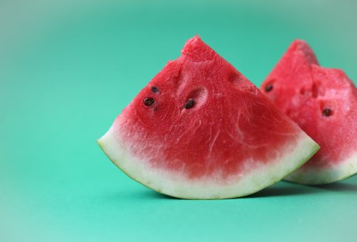 sliced watermelon on green surface
