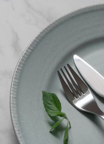 silver fork on blue round plate